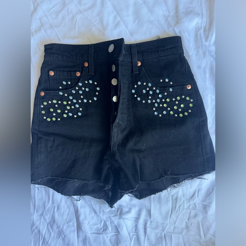 Brand new Levi’s black shorts in size 25 with gems on front.